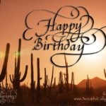Flourished Happy Birthday calligraphy with sunshine Tucson background